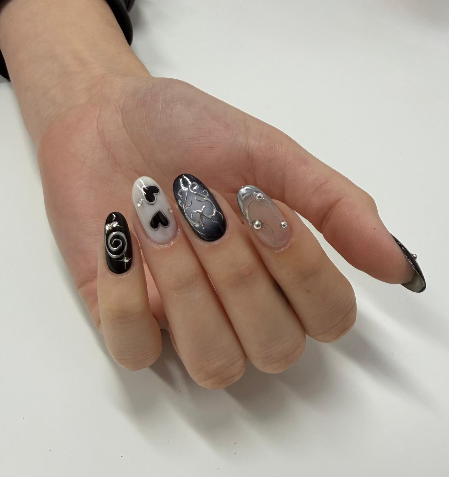 Black chrome heart nail art by Jessica