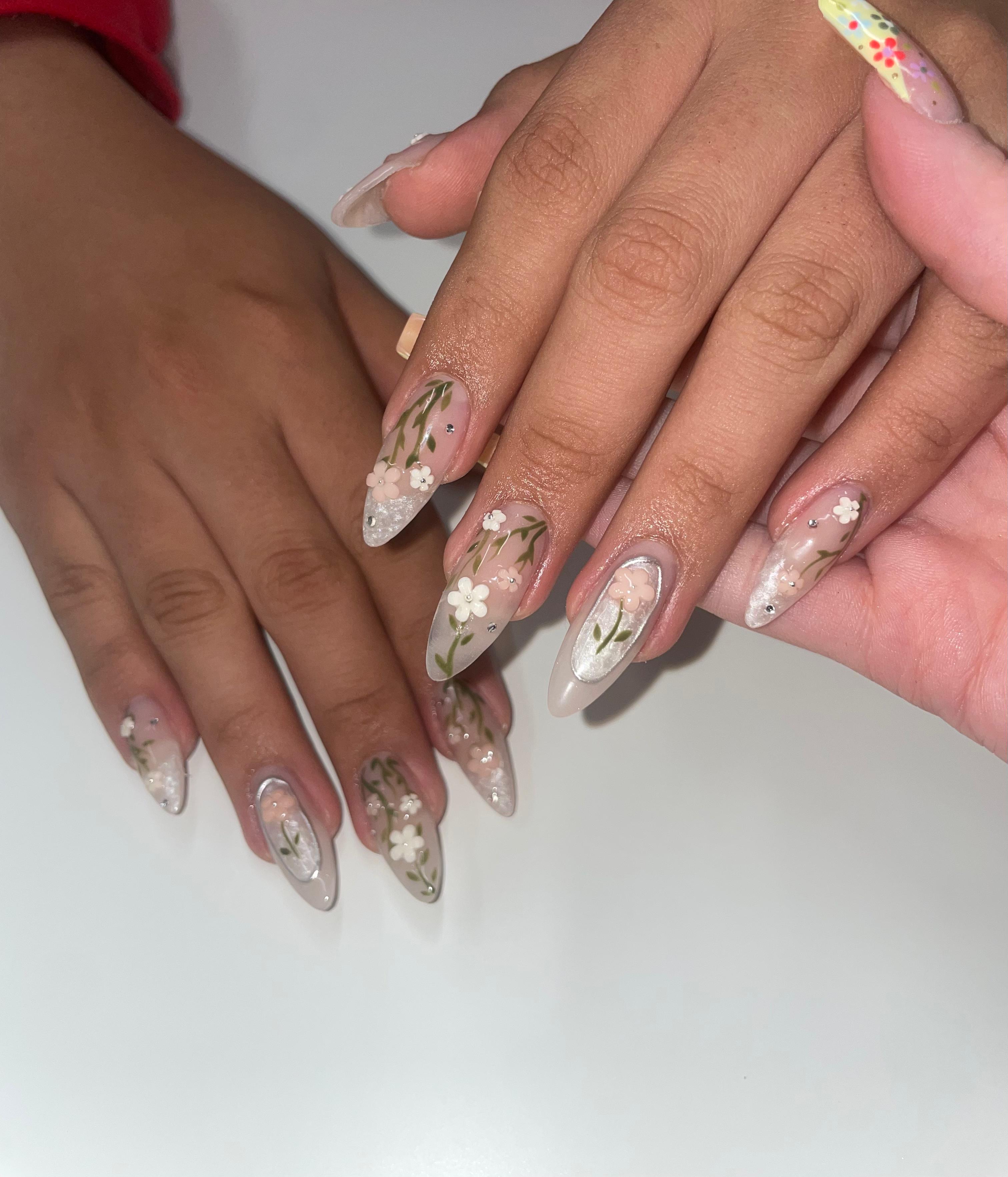 Delicate white floral nail art by Jessica